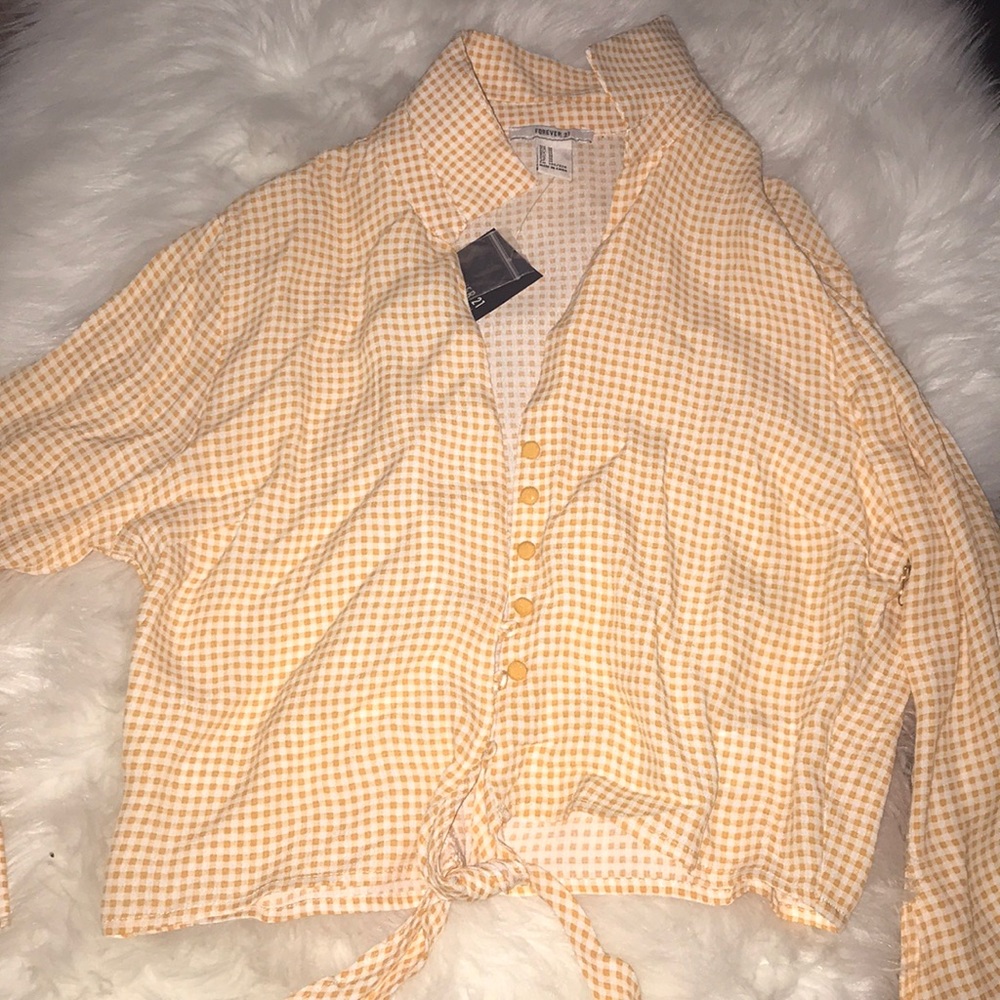 Yellow crop top.